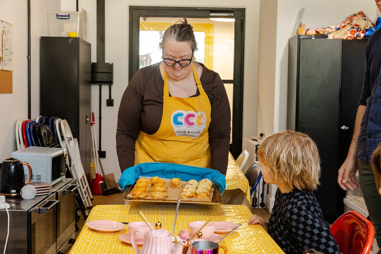 The scones are removed from the oven and brought to the table.