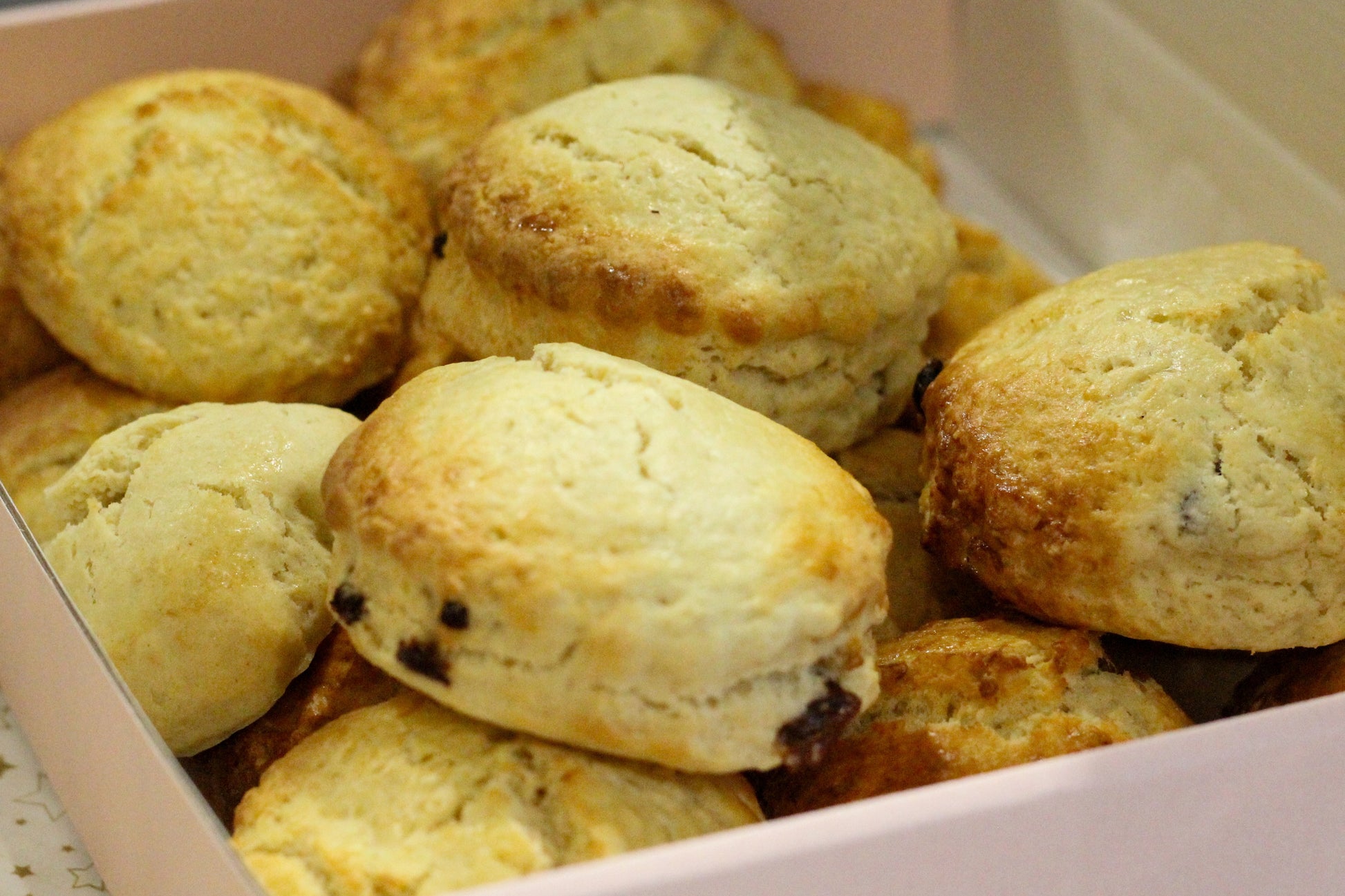 Close up on a box filled with freshly-made scones.