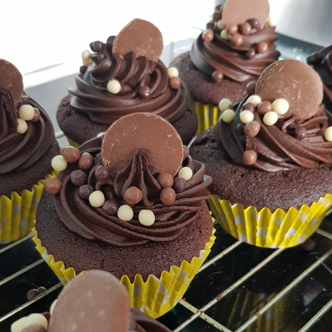 Bake and decorate delicious cupcakes like these chocolate treats with Cook and Craft Collective