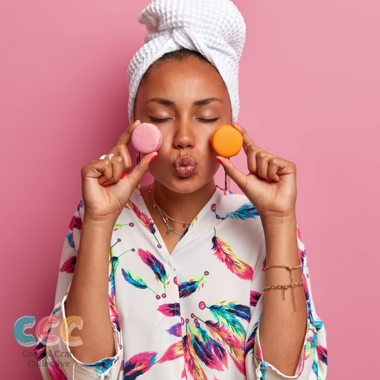 Ever wanted to learn how to make perfect French macarons from home?  Well now you can buy your own DIY activity kit and perfect the tastiest macaron. IMage shows a woman holding two macarons up to her cheeks and pouting.