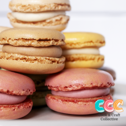 A pile of delicious french macarons on a plate.